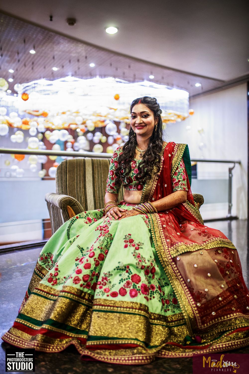 Photo of Floral print lehenga in subtle green and bold  red