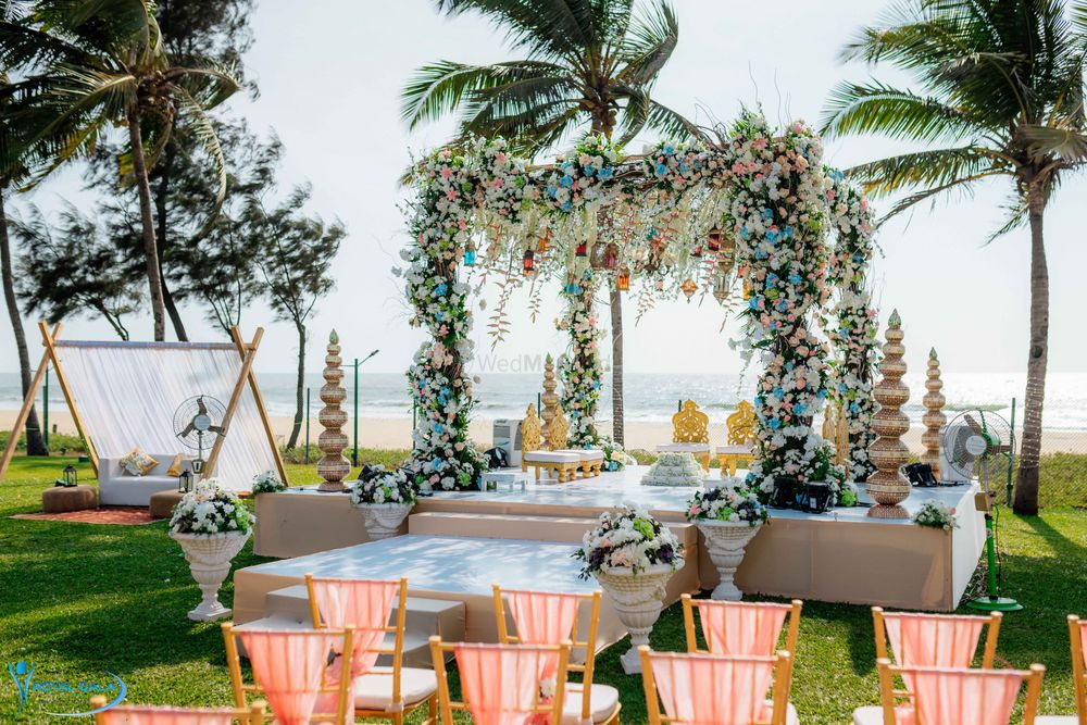 Photo of Beachside floral mandap for an outdoor wedding.