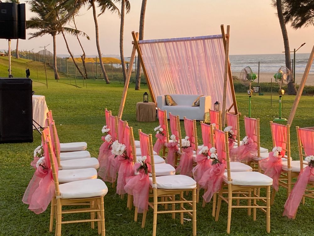 Photo of Pink Chair decoration for an outdoor wedding setup.
