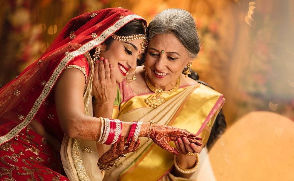 Photo of Happy picture of a bride with her mother.
