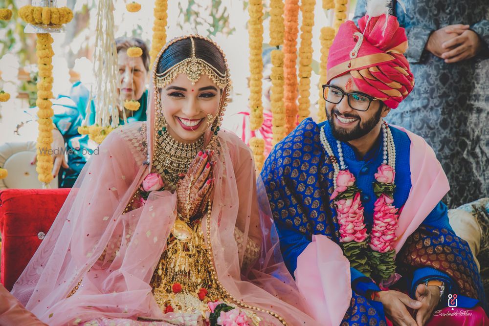 Photo of A laughing candid shot of the bride and the groom on their wedding day