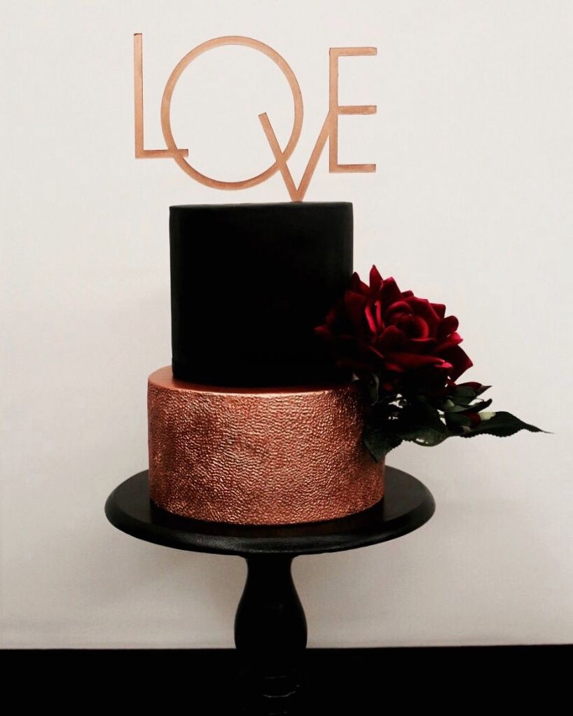 Photo of Unique black and gold 2 tier cake with love cake