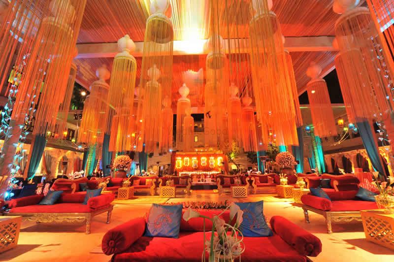 Photo of Orange Themed Decor with Floral Chandeliers