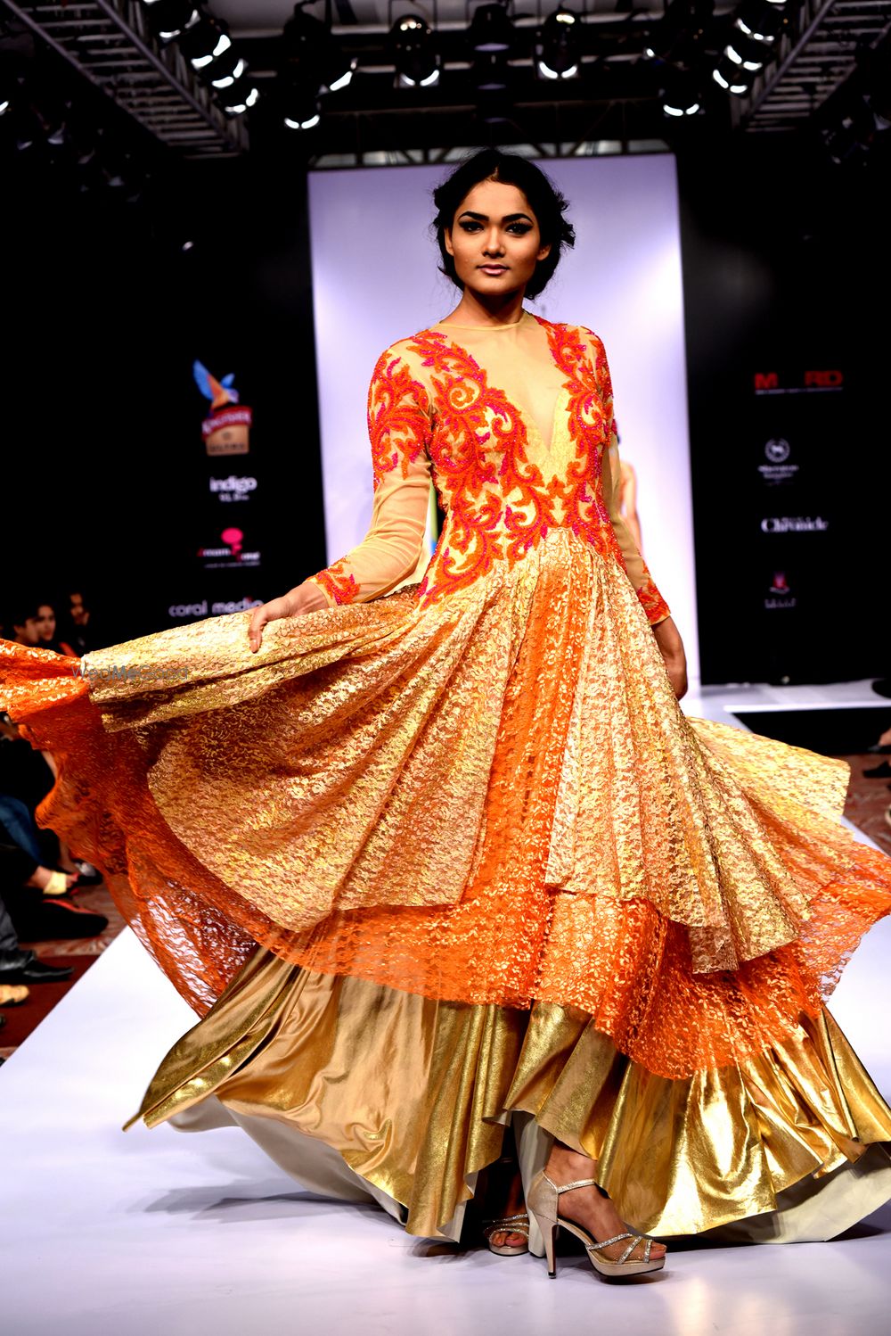 Photo of Red and Gold Multi-Flared Gown