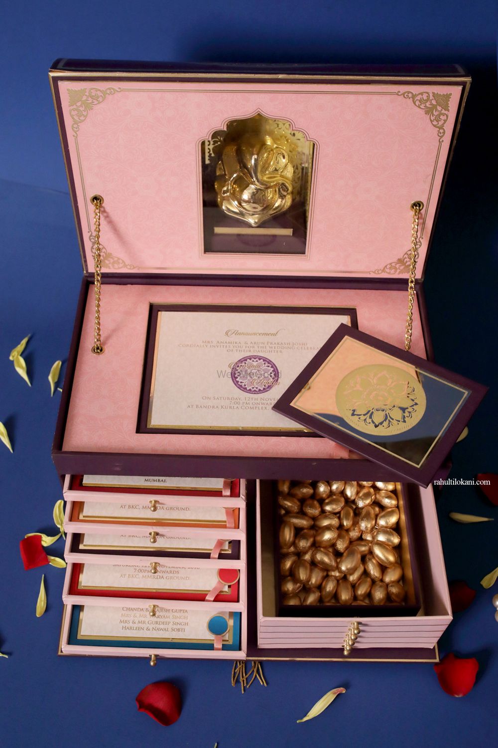 Photo of Unique wedding invite box with cards Ganesha idol and favours