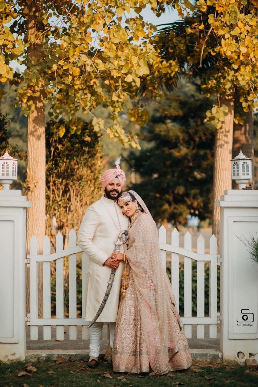 Photo of Sikh couple with both wearing matching outfits