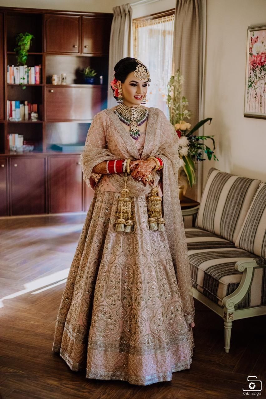 Photo of Morning bride with pastel lehenga and coloured jewellery