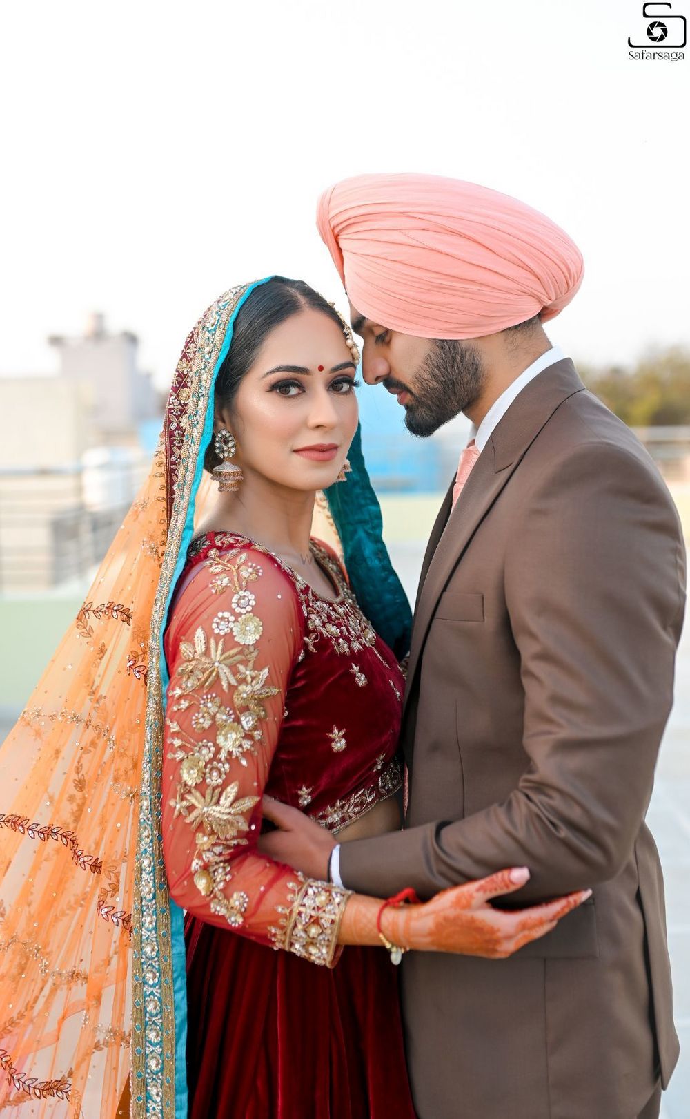Photo of A beautiful couple portrait of a Sikh bride and groom.