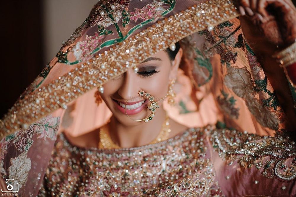 Photo of A beautiful veil shot of a Sikh bride.