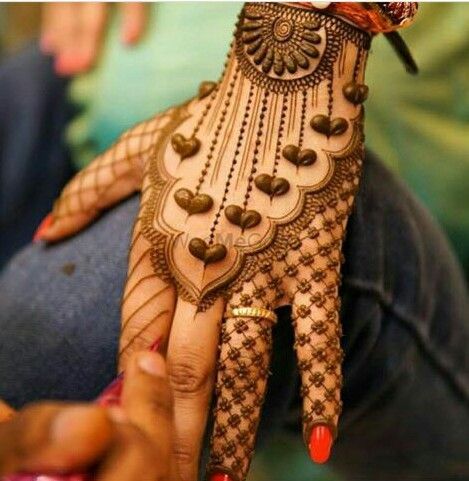 Photo of Cute mehendi design at back of the hands