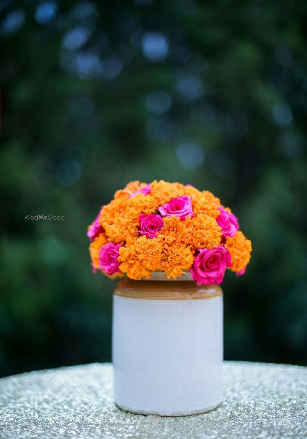 Photo of Rustic mehendi decor pickle jar with flowers