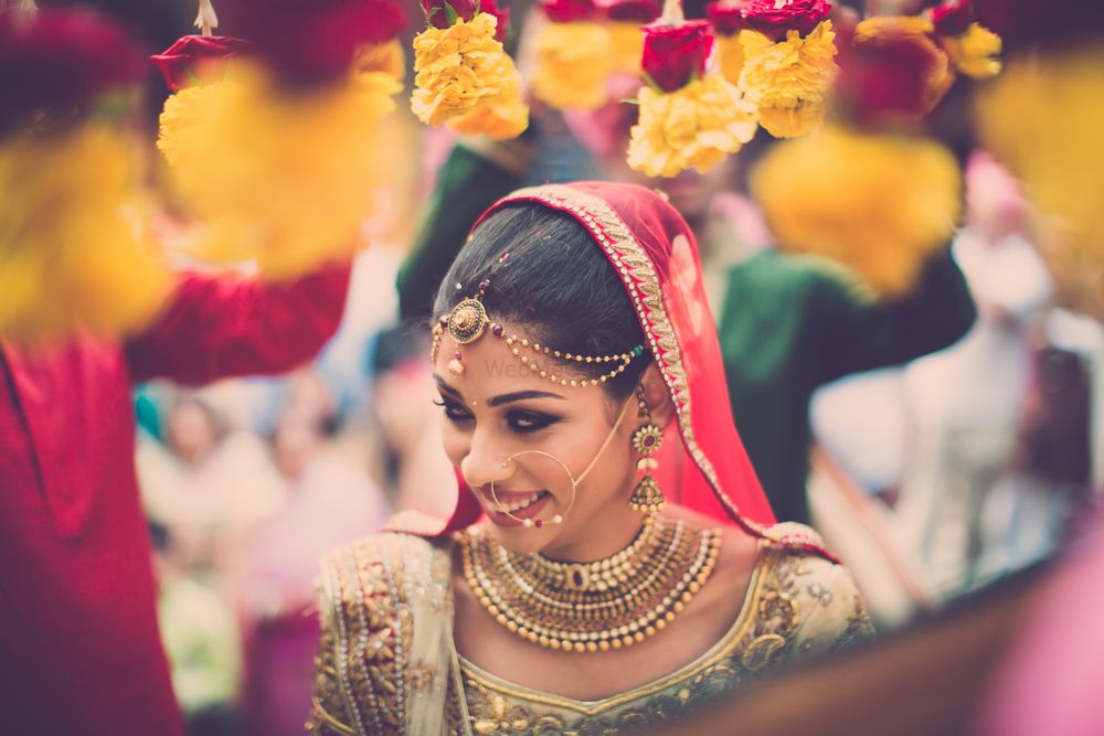 Photo of Bride Wearing Gold Coin Necklace