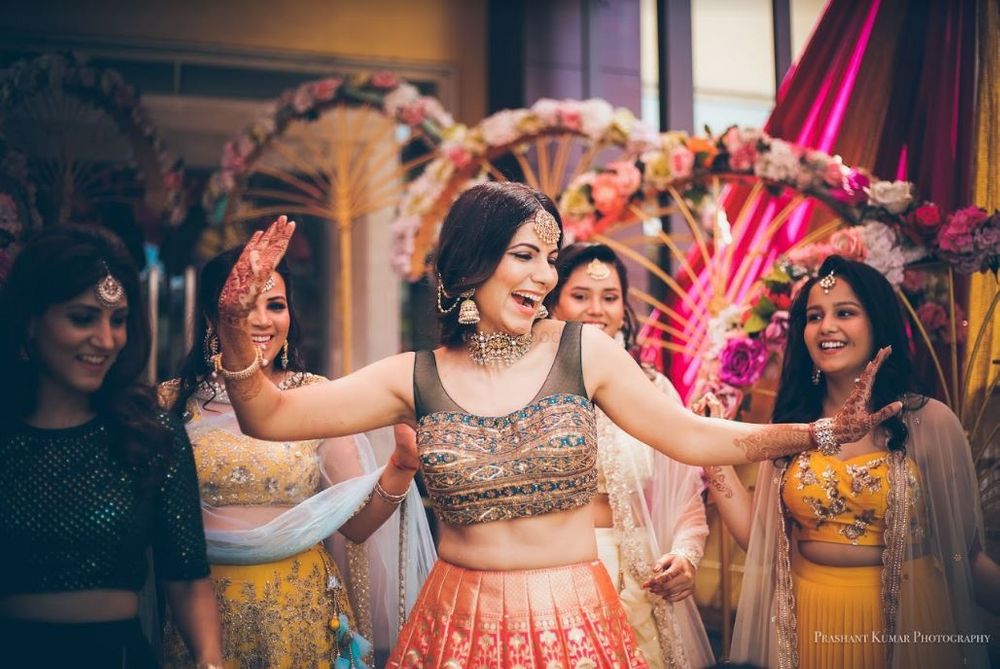 Photo of A happy dancing bride.