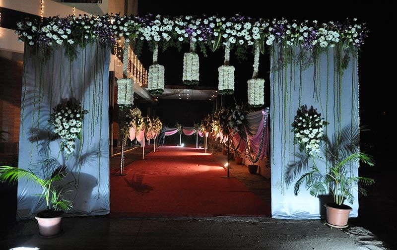 Photo of white  flower decorated entrance