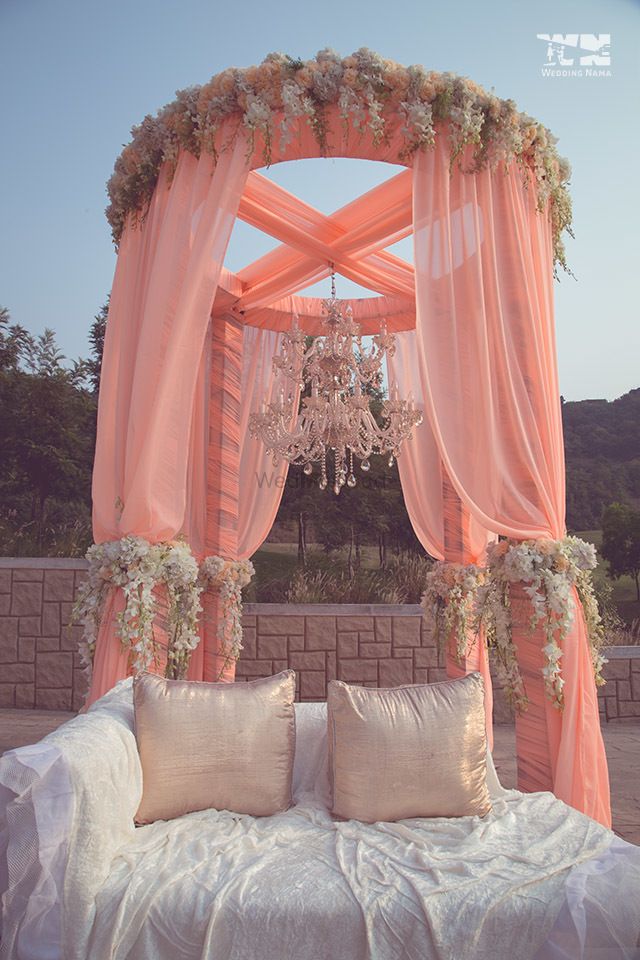 Photo of Light pink drape decor with chandelier