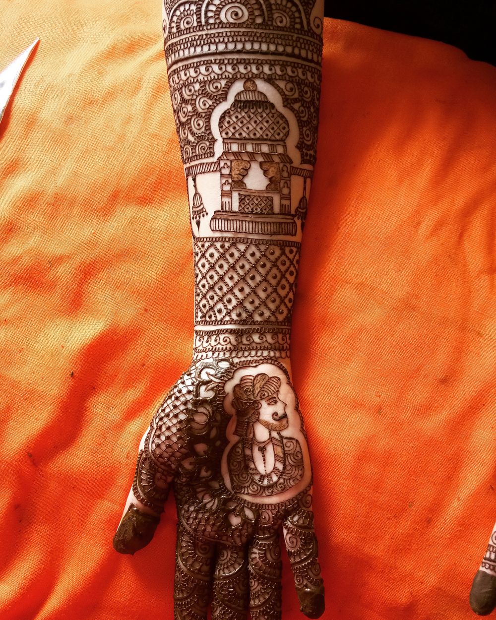 Photo of Traditional mehendi design with a twist for bride