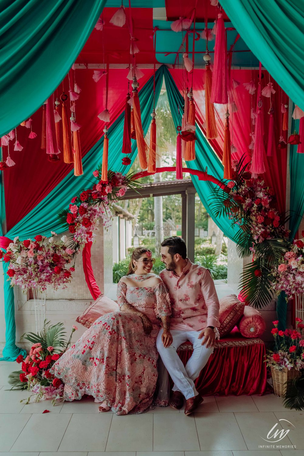 Photo of matching bride and groom with funky mehendi decor