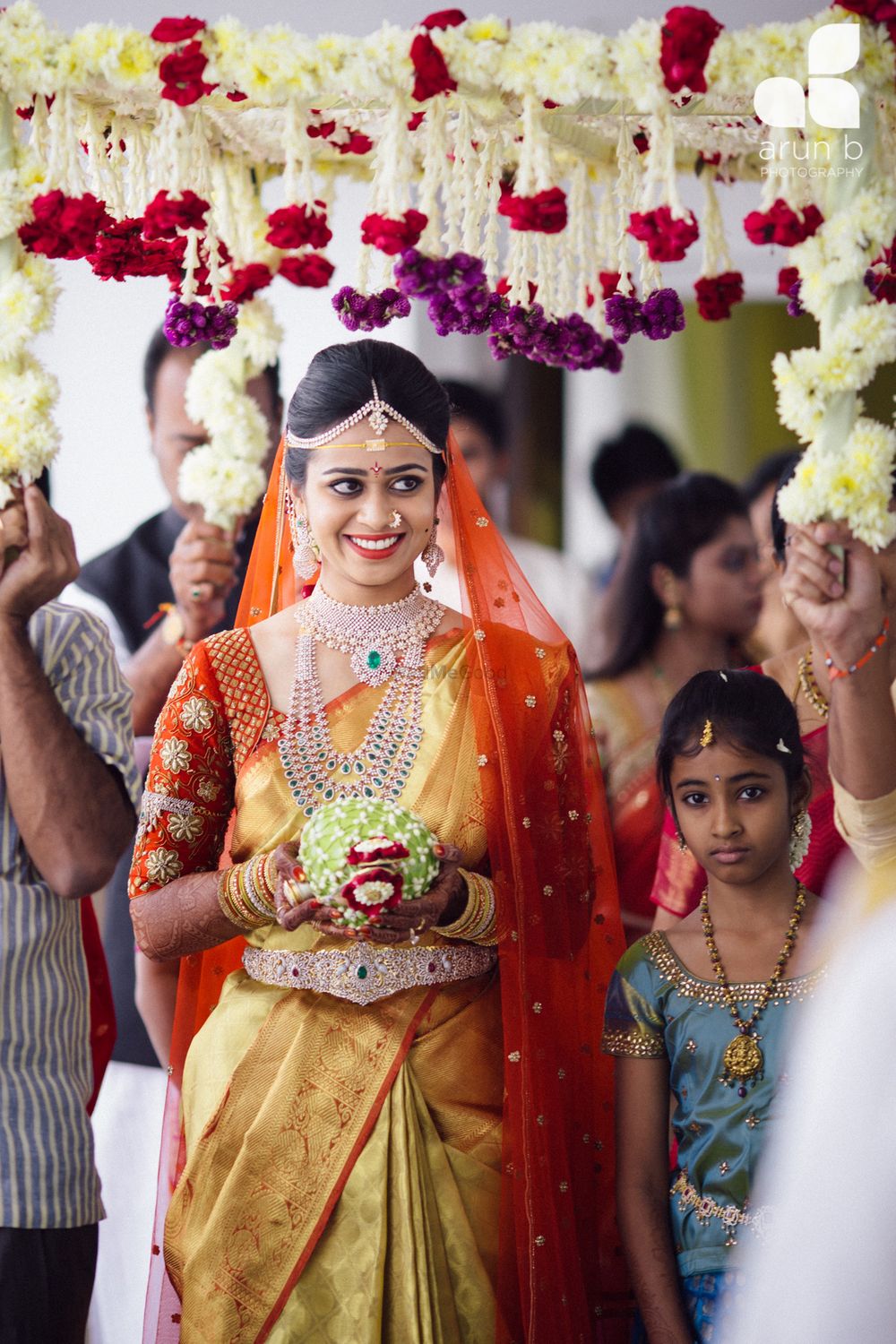 Photo of South Indian bridal entry under phoolon ka chadar