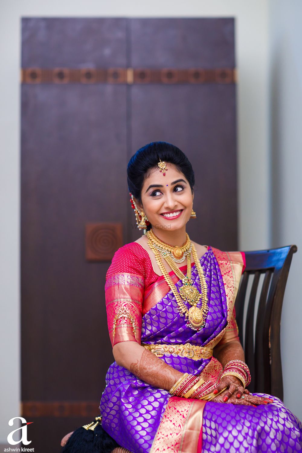 Photo of South Indian bridal look with red and purple kanjivaram