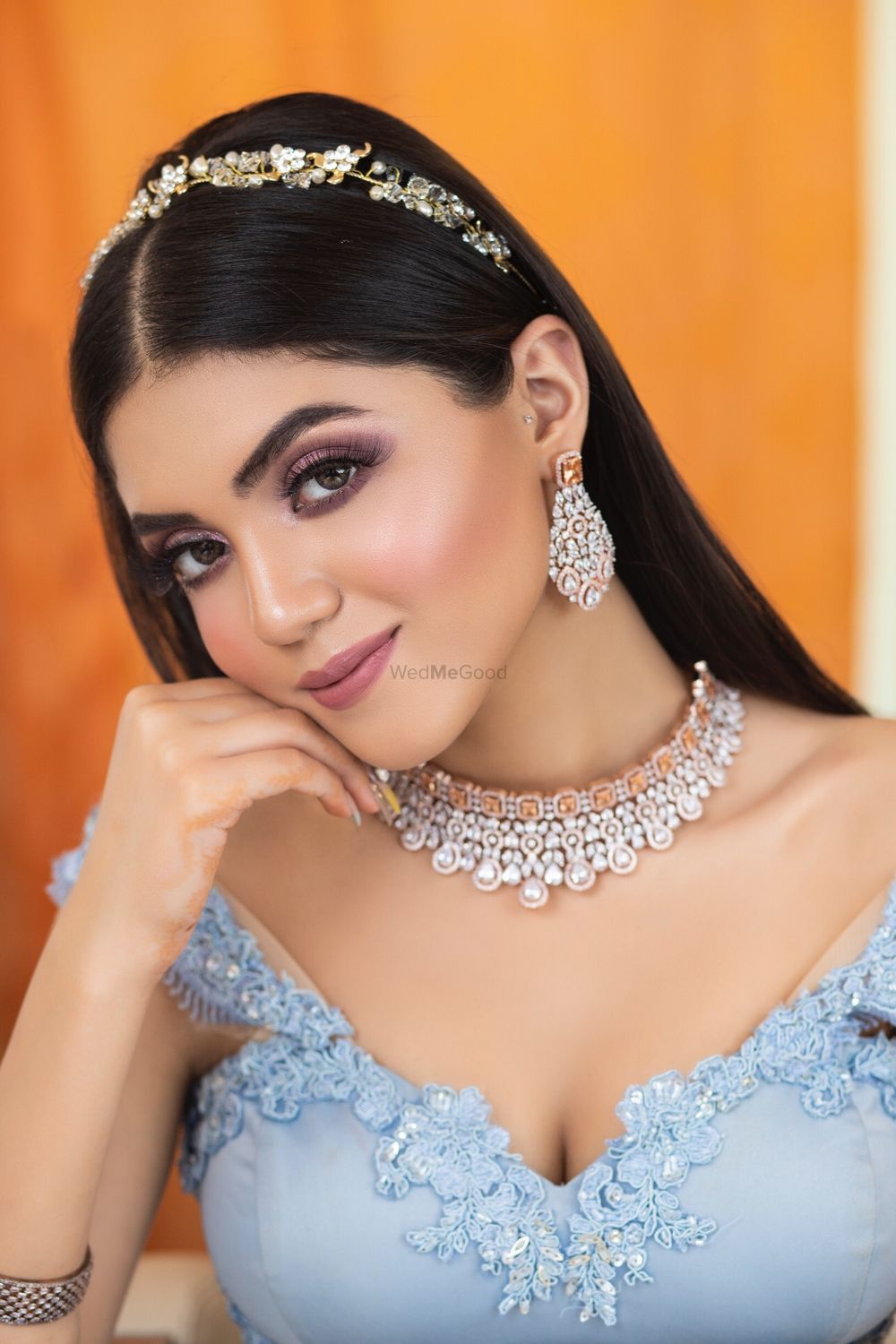 Photo of A beautiful bride in subtle makeup and jewellery on her engagement.