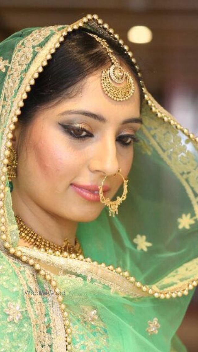 Photo By Sundra Bains - Bridal Makeup