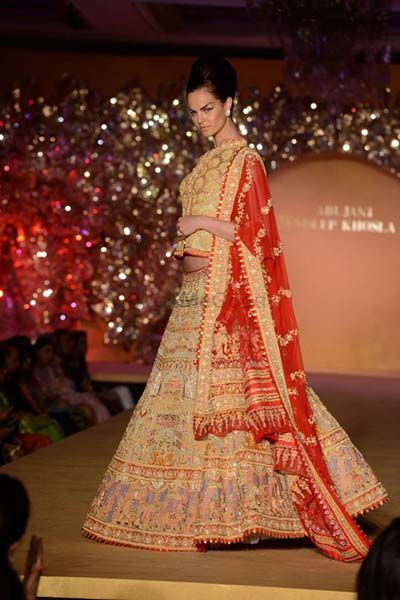 Photo of gold and red lehenga