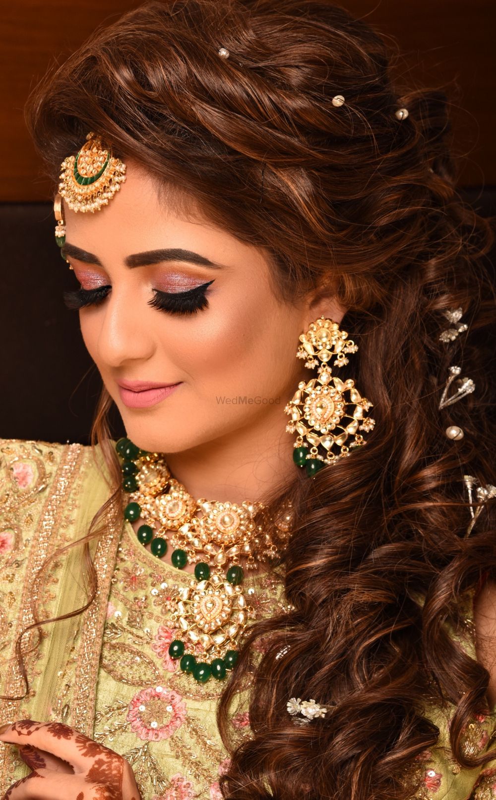 Photo of Sangeet or engagement hairstyle with pearls in hair