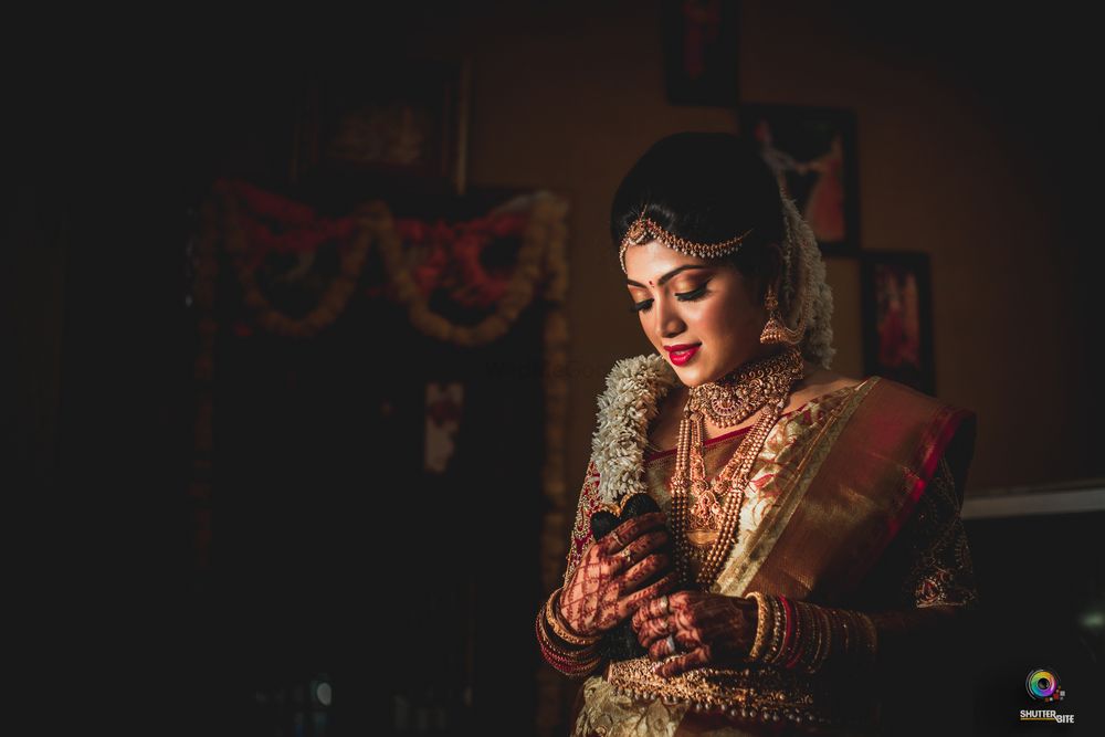 Photo of Gold south indian bridal look with floral braid