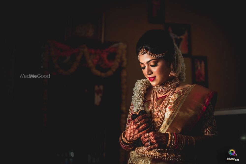 Photo of Gold south indian bridal look with floral braid