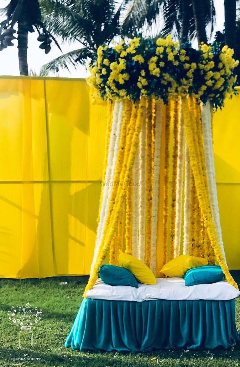 Photo of Mehndi photobooth idea with yellow and blue theme