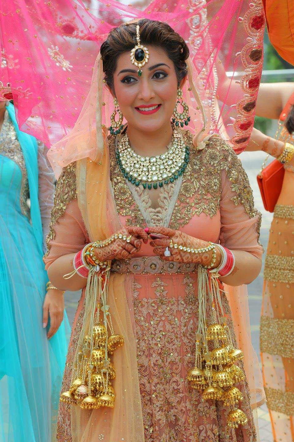 Photo of Peach Bride with Green Jewellery