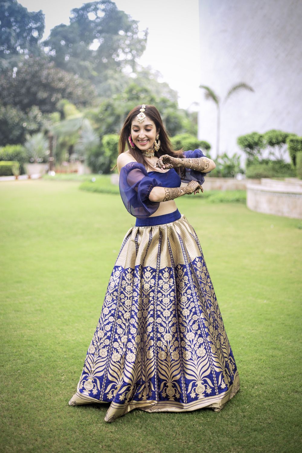 Photo of Unique blouse design with blue and gold brocade lehenga