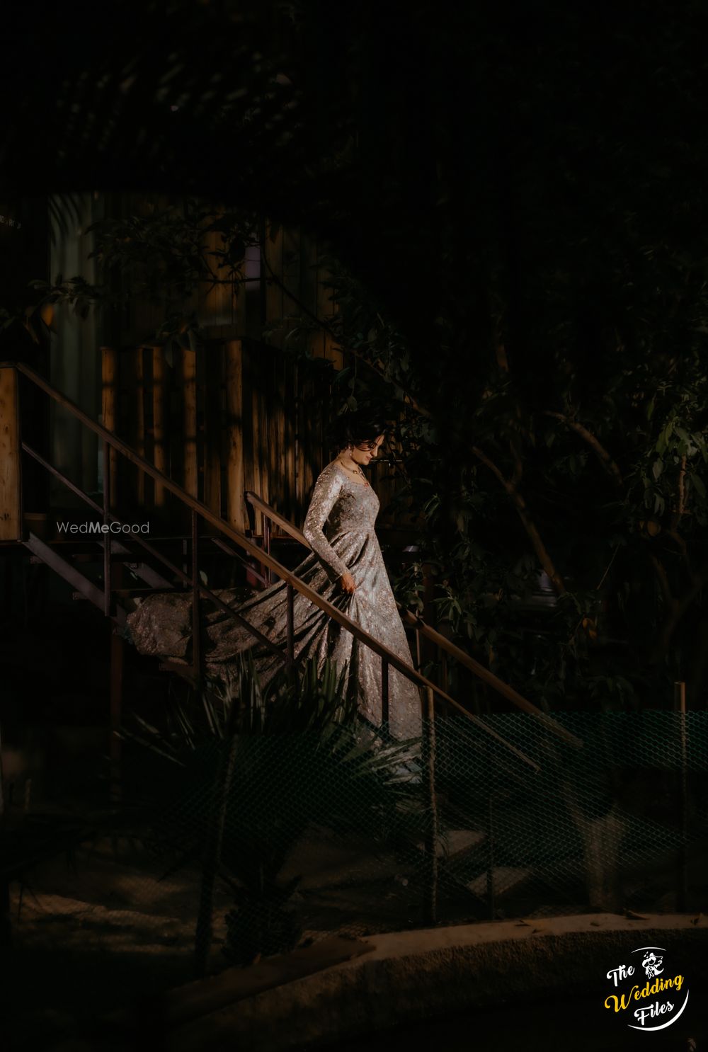 Photo of bride entering cocktail wearing a gown