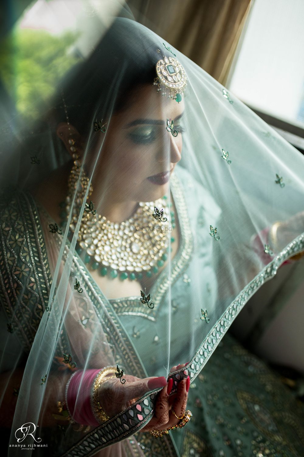 Photo of Bride under a veil shot
