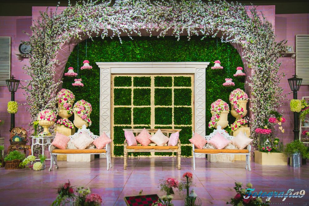 Photo of Floral Ceiling Decor with Pastel Color Seating