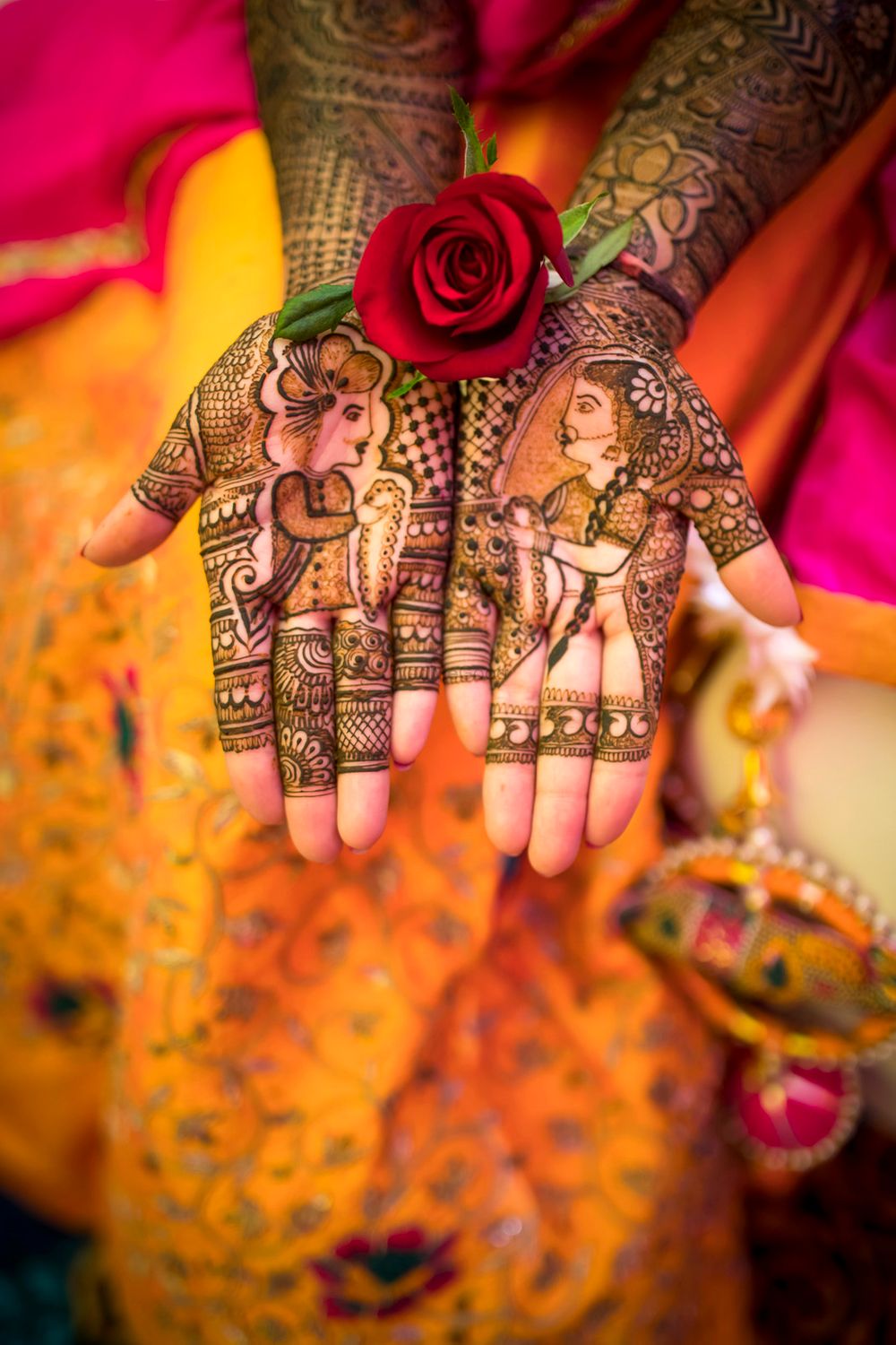 Photo of Modern mehendi with bride and groom caricatures