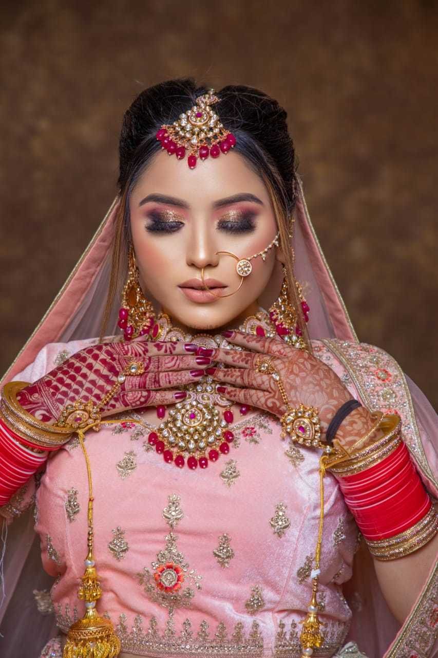 Photo By hudda beauty - Bridal Makeup