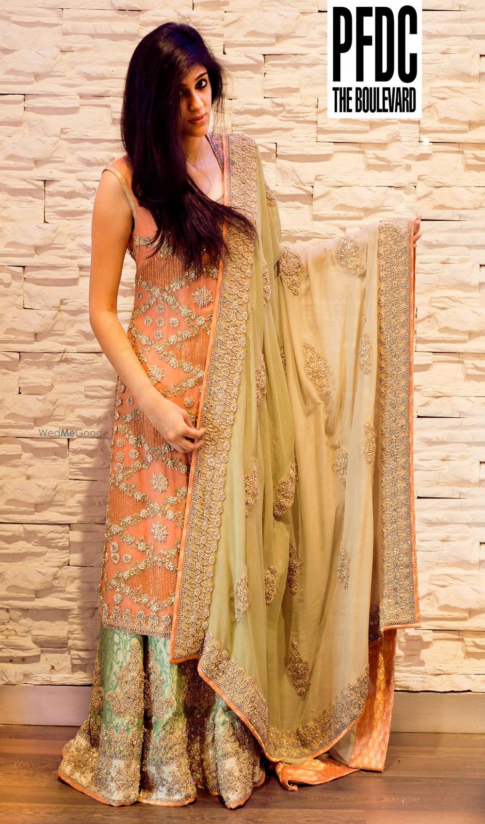 Photo of peach heavy embellished sharara with mint green silk sharraa pant and gold dupatta