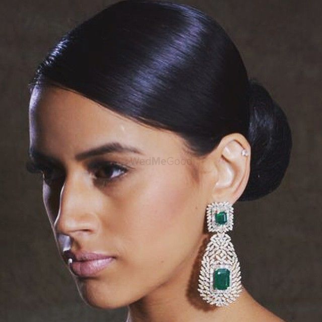 Photo of large diamond and emerald drop earrings