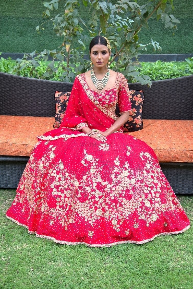 Photo of Light bridal lehenga in red with floral embroidery
