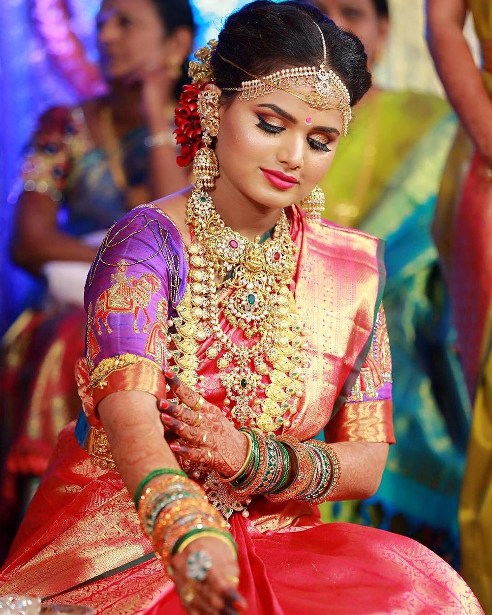 Photo of south indian bride wearing purple and pink kanjivaram saree