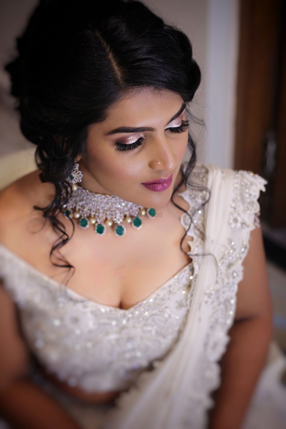 Photo of Shimmery eye makeup for engagement with contrasting necklace