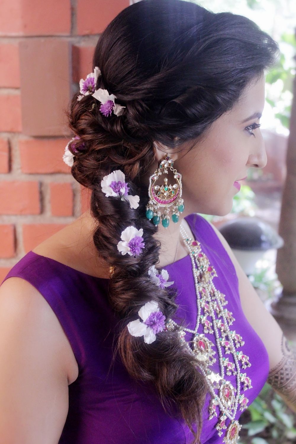 Photo of Mehendi braid with purple flowers