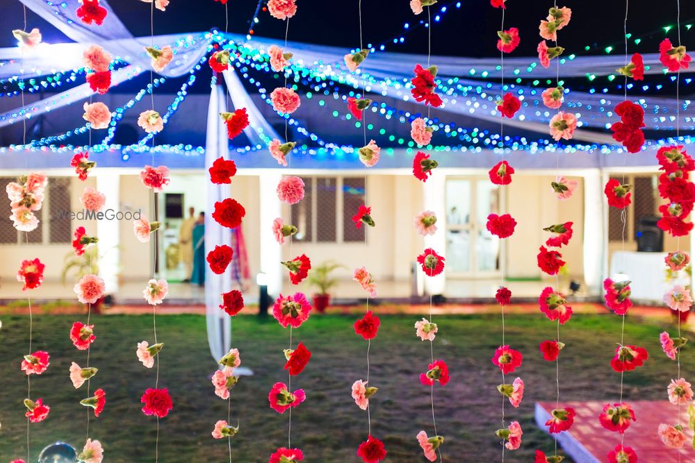 Photo of Backyard mehendi decor with floral strings