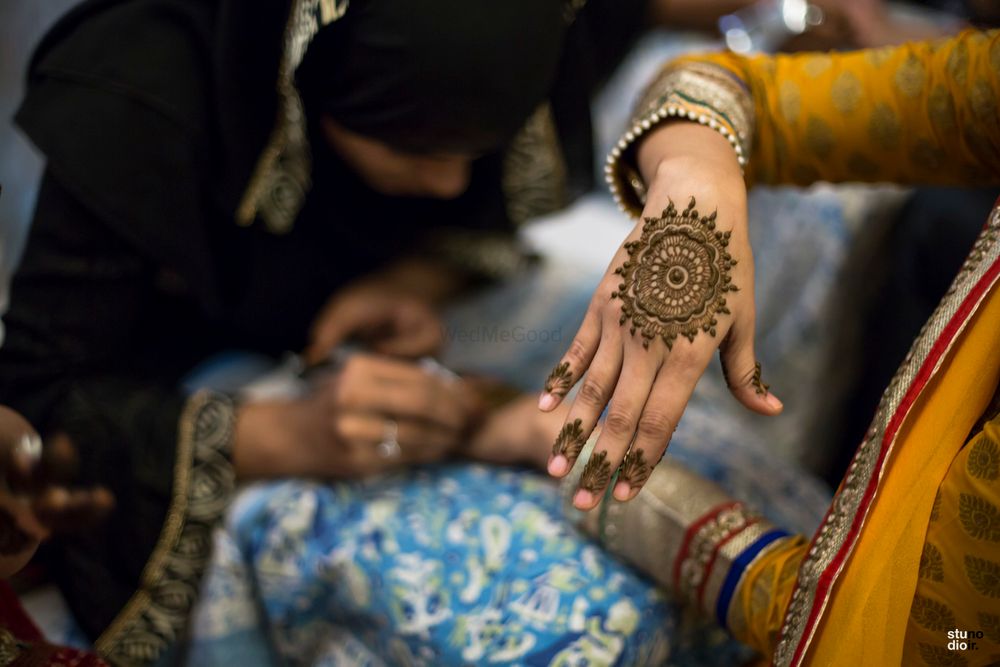 Photo of Minimal mandala mehendi design on the back of the hand