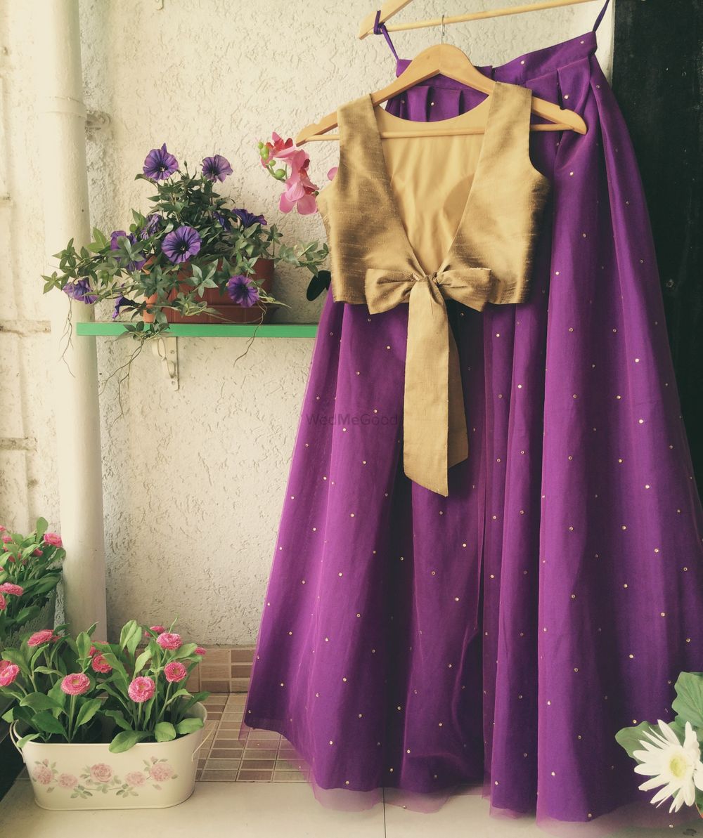 Photo of Light purple lehenga with gold blouse with a bow