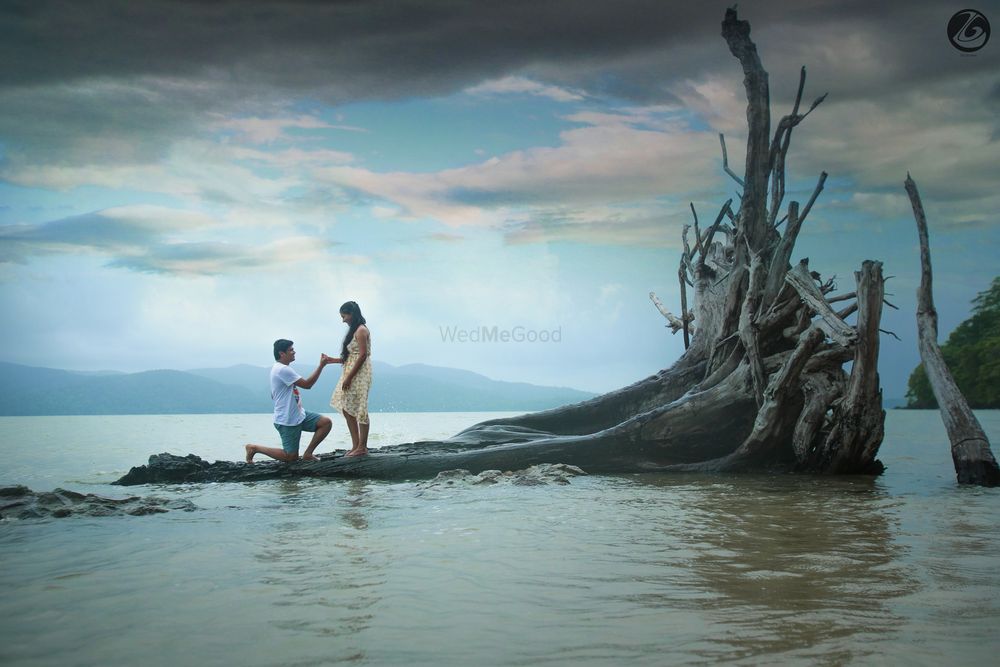 Photo of Pretty Proposal Shot Next to the Sea