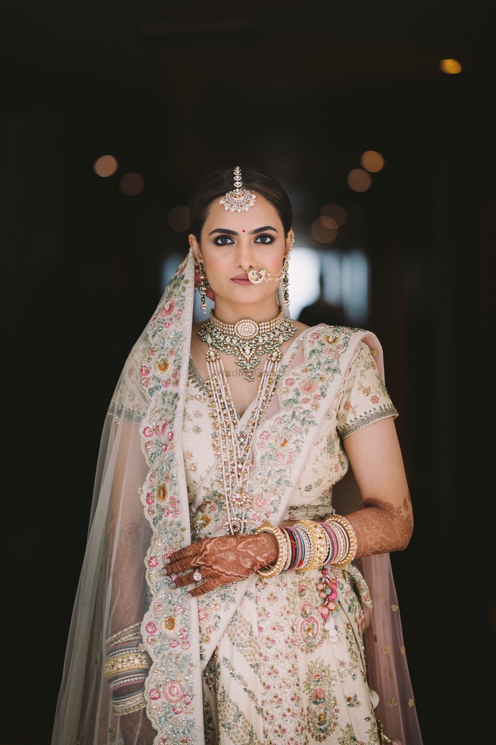Photo of Offbeat bridal lehenga in ivory with silver jewellery