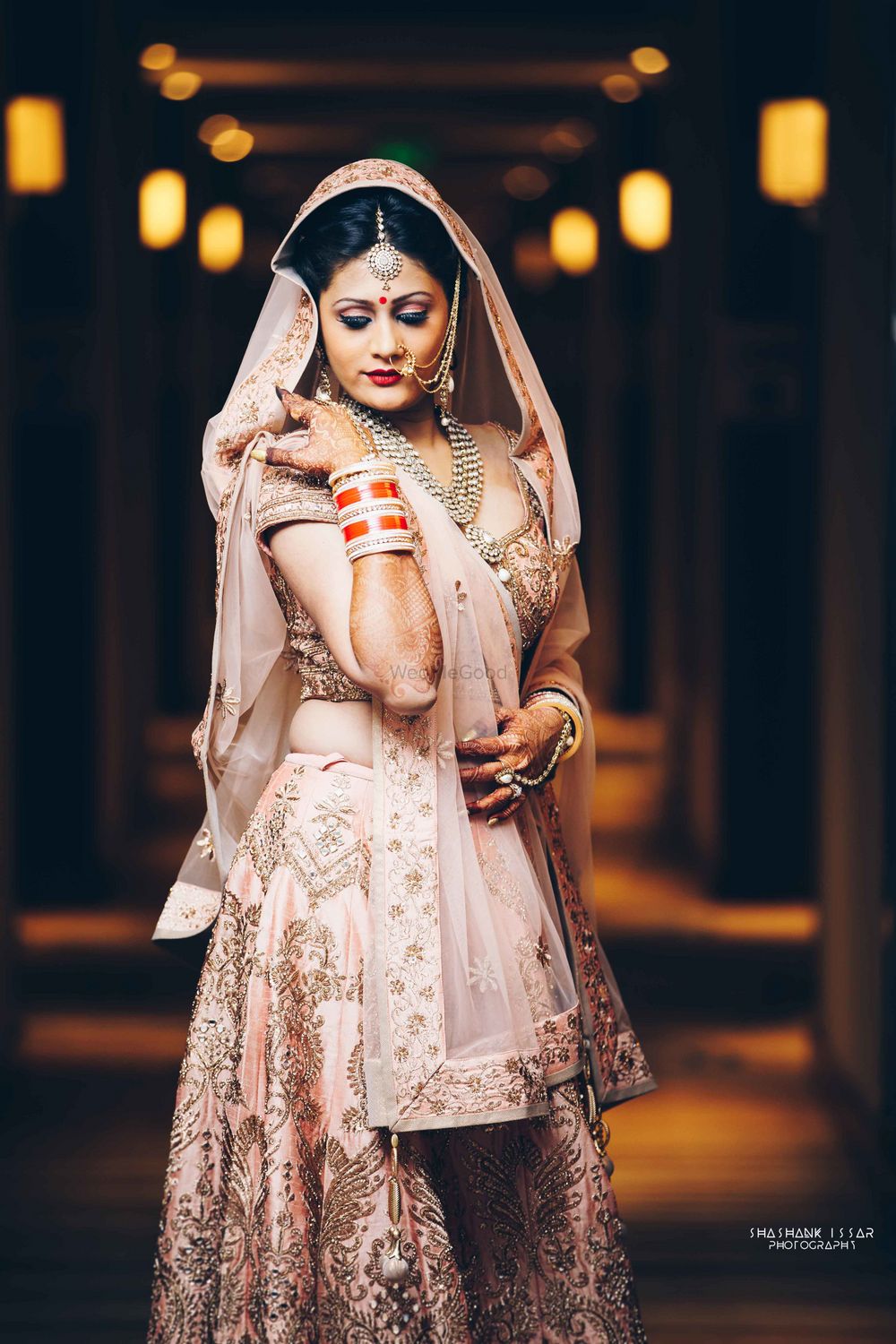 Photo of Pink and gold embellished bridal lehenga