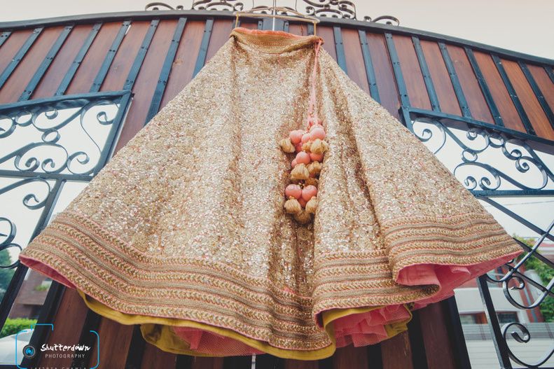 Photo of Sequins Gold Lehenga on a Hanger